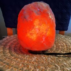 a large orange rock sitting on top of a table