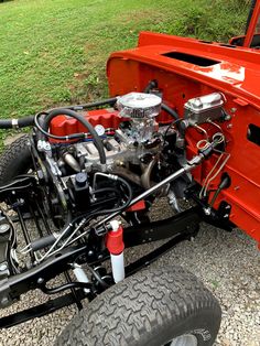 an orange truck with a big engine on it's bed