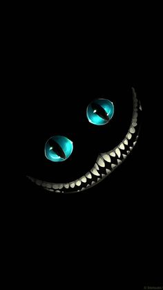 an image of a smile made out of metal in the dark with two blue eyes