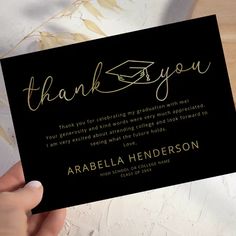 a person holding up a thank card for someone