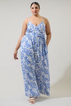 The Camellia Floral Vicky Wide Leg Jumpsuit is a look that can take you anywhere you want to go! Lightweight floral fabric sweeps chicly across a sleeveless, surplice bodice with pleated detail and a zipper back. A tying sash belt adjusts around the waist. Wear it with heels and gold simple accessories to go along perfectly. - Adjustable spaghetti straps- Wide leg- belt sash- Zipper- Color: Wht Blue MultiSize + Fit - Model is 5'10" and wearing size 2X- Measurements taken from size 2X- Chest: 12 Flowy Sleeveless Jumpsuits And Rompers For Day Out, Flowy Sleeveless Jumpsuit For Day Out, Sleeveless Floral Print Jumpsuits And Rompers For Beach, Printed Sleeveless Jumpsuits And Rompers For Loungewear, Blue Jumpsuits And Rompers For Spring Daywear, Summer Floral Print Maxi Dress For Loungewear, Floral Print Sleeveless Jumpsuits And Rompers For Day Out, Summer Floral Print Maxi Jumpsuits And Rompers, Blue Maxi Length Jumpsuits And Rompers For Spring