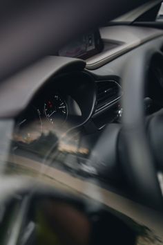 the interior of a car with dashboard lights and steering wheel