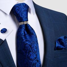 The Clever Collection is one of our best selling tie sets! It features a classic paisley design pattern with varying blue tones. To add a little pop to your black or blue suit, this set also includes a standard size matching pocket square and cufflinks. As an added bonus, this set also includes tie ring that is covered in meticulously selected crystals in a prong setting and polished to ensure a brilliant shine. Specifications Ties Type: Neck Tie SetSize: One SizeModel Number: JZ04-1435Pattern T Cravat Tie, Tie Ring, Wedding Party Accessories, Tie For Men, Paisley Tie, Cufflink Set, Cufflinks Wedding, Wedding Ties, Mens Neck Ties