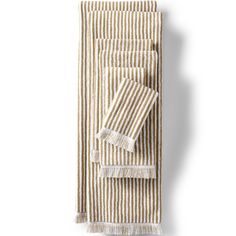 three striped towels with fringes on them