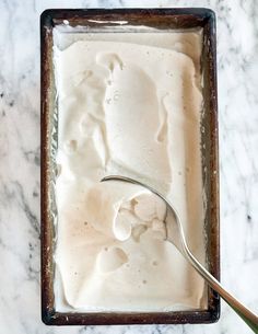 an ice cream dish with a spoon in it