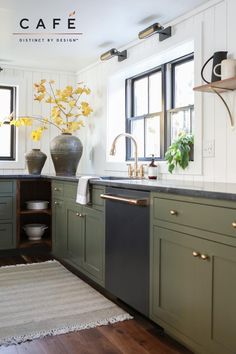 a kitchen with green cabinets and white walls