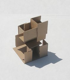 an open cardboard box sitting on top of a white surface