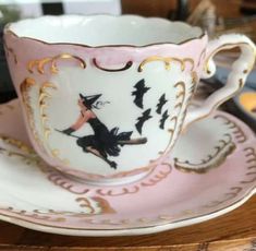 a cup and saucer on a wooden table