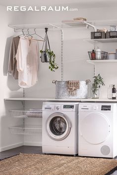 a washer and dryer sitting in a room next to a shelf with clothes on it