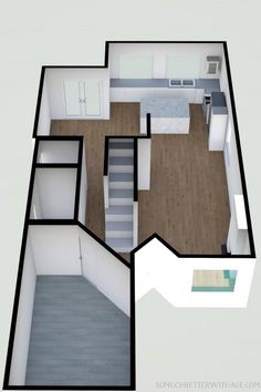 an overhead view of a kitchen and living room in a small apartment with stairs leading up to the second floor