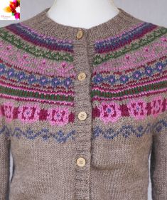 a knitted cardigan sweater with multicolored patterns on the front and back