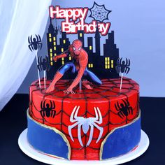 a spiderman birthday cake on a table