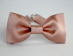 "This trendy and stylish bow tie is great for so many occasions! Bow tie made of shiny satin fabric with a matching, adjustable neck strap. Style: * The Pre-Tied Bow Tie (with an adjustable neck strap) * The Clip-On Bow Tie (strapless, just a clip that you attach to the shirt collar) * Pocket square (handkerchief) All our bow ties can be made in the following sizes, just specify which size you need in a note at checkout: Sizes: Baby: 3.5\" x 2\" Kids: 4\" x 2\" Youth: 4.5\" x 2.25 Adult: 5\" x 2 Satin Bow With Bow Tie Back For Gifts, Dapper Adjustable Bow Tie For Weddings, Elegant Adjustable Bow Tie For Groom, Adjustable Dapper Bow For Wedding, Adjustable Dapper Wedding Bow, Adjustable Detachable Bow For Wedding, Dapper Bow Tie With Detachable Bow For Weddings, Dapper Wedding Bow Tie With Detachable Bow, Dapper Detachable Bow Tie For Weddings