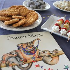 there are many desserts on the table and one has a book about possum magic