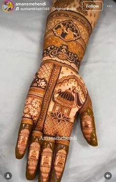 the hand is decorated with intricate designs