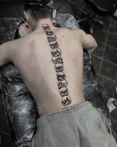 a man with a tattoo on his back