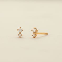 Shining, shimmering, splendid– a whole new world awaits with the petite double stone studs. Two prong-set CZs, set next to each other in gold vermeil, set the scene for a magical moment in the making. The subtle sparkle of this pair takes your look to a dazzling place you never knew. Diamond Gold Ear Climbers As Gift, Gold Diamond Ear Climbers For Gifts, Gold Prong Setting Ear Climbers For Gift, Gold Bar Necklace Personalized, Double Stud, Made By Mary, Stone Stud Earrings, Gold Bar Necklace, Whole New World