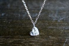 A small silver heart, hammered lightly, on a delicate sterling silver chain.  Heart is 9 x 8 mm {5/16 of an inch at it's widest.} Sterling silver. Necklace as shown in the 3rd picture is 17 inches total length. Please choose your length preference from the drop-down options or leave me a message in the 'note to seller' box at checkout. Please let me know if you have any questions!«««««««««««««««««««««««««««««««««««««««««««««««««««««««««««««««««««««««««If you need more that what I have shown as a Everyday White Sterling Silver Heart Necklace, Silver Heart Necklace With Delicate Chain, Simple Silver Heart Necklace With Delicate Chain, Silver Heart Cut Necklace With Delicate Chain, Delicate Silver Necklace For Anniversary Gift, Hammered Silver Heart Jewelry, Delicate Personalized Heart Necklace In Sterling Silver, Delicate Sterling Silver Heart Necklace For Anniversary, Delicate Sterling Silver Personalized Heart Necklace