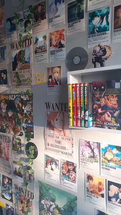 the wall is covered with many anime posters