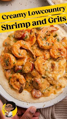 a white plate topped with shrimp and grits next to a person's hand