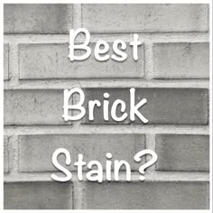 the words, best brick stain? written in white letters on a grey brick wall