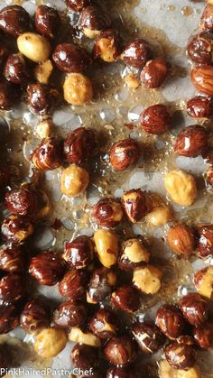 some nuts are sitting on a sheet of wax