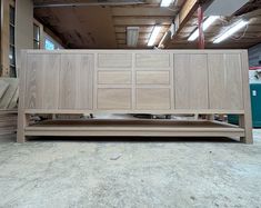 a large wooden cabinet sitting inside of a building