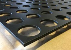 there is a metal grate with holes on it