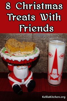 a christmas treat with friends is sitting next to a glass of milk and a candle