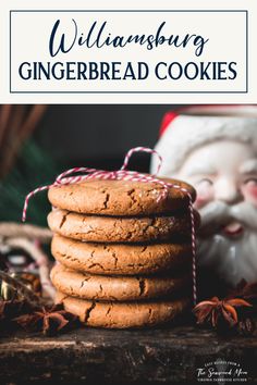 a stack of gingerbread cookies next to a santa clause