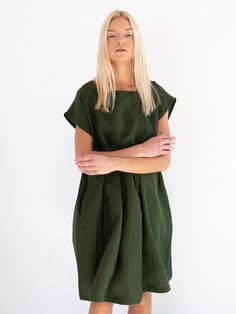 "POPPY is a loose fitting linen dress with side seam pockets. DETAILS - Below the knee length - Smock silhouette - Short sleeve - Side seam pockets - Oeko-Tex certified 100% midweight linen - Cut and sewn to order just for you in our studio COLOR - Forest green, you can also choose other colors above - Fabric samples are available here https://www.etsy.com/listing/586569696/linen-fabric-samples SIZING & FIT - Relaxed fit - Length (shoulder to hem) is approximately 38 inches / 97 cm - Bust (p Solid Linen Dress With Pockets, Linen Workwear Dress With Side Pockets, Casual Linen Work Dress With Side Pockets, Green Relaxed Fit Linen Dress With Pockets, Workwear Linen Dress With Side Pockets, Casual Workwear Linen Dress With Side Pockets, Linen Summer Dress, Summer Dress For Women, Maternity Dresses Summer