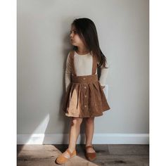 Our Fallon corduroy suspender skirts have adjustable straps to grow with your sweetheart! Adorable pleats and button accents make this staple as perfect as can be! FIT: This item is true to size. FABRIC & CARE: * 92% polyester and 8% spandex * Imported * Machine washable Fall Picture Outfits, Toddler Fall Outfits Girl, Baby Suspenders, Toddler Girl Fall, Long Sleeve Leotard, Girls Fall Outfits, Suspender Skirt, Picture Outfits, Knee High Socks