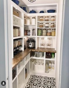 a pantry with lots of shelves and containers