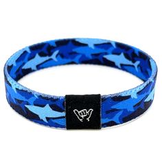 Shark Frenzy Wristband Bracelet. Available sizes:  Extra Small 5.5" (petites + kids) Small 6.5" (most common fitting size) Medium 7.5" (large wrists) Large or Anklet 8.5" (very large wrists or anklet) 1/2" Width Reversible surf and beachy prints. Elastic blend material, can stretch to desired fit. Packaged in natural drawstring gift pouches. Machine washable. Chlorine and saltwater safe. Hang Loose Bracelet, Shark Bracelet, Coastal Bracelet, Loose Bracelet, Beachy Prints, Surf Design, Wristband Bracelet, Hang Loose, Beach Print