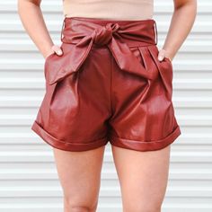 Leather Shorts With Zipper In The Back. Pockets. Belt That Ties. Never Worn. Still Tagged. Maroon Color. Leather Bottoms For Going Out In Summer, Casual Faux Leather Bottoms For Summer, Summer Casual Faux Leather Bottoms, Casual Faux Leather Shorts For Party, Casual Faux Leather Party Shorts, Summer Brown Faux Leather Bottoms, Casual Faux Leather Shorts For Going Out, Casual Brown Shorts For Night Out, Casual Party Shorts For Fall