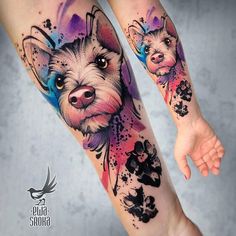 a woman's leg with tattoos on it and an image of a dog in the background