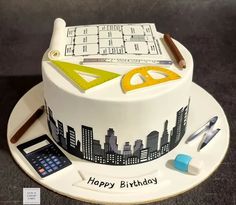 a birthday cake decorated with an architectural theme