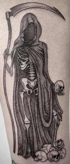 a tattoo with a skeleton holding a sculler and a skull on it's thigh