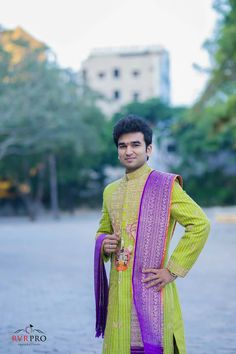 a man in a yellow and purple outfit