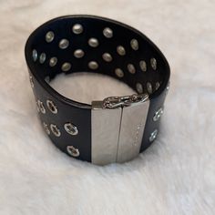 Coach Black And Silver Leather Bracelet. Magnetic Closure With A Lobster Claw. Slight Scratching On The Silver Closure As Shown In Pictures. Approximately 7”. Smoke And Pet Free Home. Chic Leather Bracelet Jewelry, Black Leather Bracelets With Studs, Luxury Adjustable Bracelet By Coach, Luxury Adjustable Coach Bracelets, Chic Adjustable Leather Bracelet For Parties, Black Studded Bracelets For Party, Luxury Adjustable Coach Bracelet, Black Trendy Bracelets With Studs, Trendy Black Bracelets With Studs