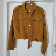 Free People Short Utility Jacket. Nwt Size Medium. Super Cute! Color Is Mustard. But It's More Camel Brown In Color Than Mustard. Smoke And Pet Free Home. Make Me An Offer!! Fall Utility Workwear Outerwear, Utility Outerwear For Work In Fall, Utility Outerwear For Fall Workwear, Utility Style Fall Outerwear For Work, Fall Utility Outerwear With Snap Buttons, Utility Style Cropped Jacket With Flap Pockets, Utility Cropped Jacket With Pockets For Fall, Khaki Utility Outerwear For Fall, Utility Style Khaki Outerwear For Fall