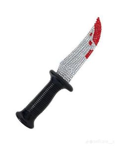 a red and black knife with silver accents on it's blade is shown in this image