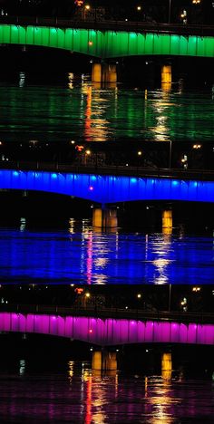 colorful lights reflecting off the water at night