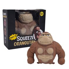 an orangutan toy is in front of a box with the packaging on it