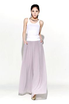 "Understated but oh-so elegant, these beautifully streamlined gray chiffon palazzo pants are made in whisper-soft chiffon. Designed to flatter and create a wonderful silhouette no matter what size or shape you are. These chiffon palazzo pants would make a wonderful and slightly alternative mother-of-the-bride wedding outfit. They are so floaty and elegant, just perfect for a wedding party. FEATURES - Chiffon fabric, fully chiffon liner - Right side zipper - Pleated around the waist -Loose fit -O Bridesmaid Pants, Chiffon Palazzo Pants, Maxi Pants, Chiffon Pants, Mother Of The Bride Dresses Long, Mother Of The Bride Gown, Pants High Waisted, Mother Of The Bride Outfit, 90's Fashion