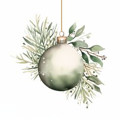 a christmas ornament hanging from a tree branch with green leaves and branches around it