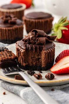 chocolate cheesecakes and strawberries on a plate