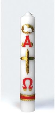 a white candle with red and gold letters on it