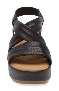 A chunky platform and wedge heel add stylish height to a strappy leather sandal set on a cushioned footbed for comfortable wear. 2 1/2" heel; 1 1/2" platform Elasticized slingback strap Cushioned footbed Leather upper and lining/synthetic sole Imported Slingback Wedge Sandals With Platform, Medium Width Slingback Wedge Sandals With Platform, Modern Slingback Sandals With Wedge Heel, Slingback Synthetic Wedge Sandals With Cushioned Footbed, Cushioned Slingback Wedge Sandals In Synthetic, Slingback Wedge Sandals With Cushioned Footbed, Modern Platform Wedge Sandals With Slingback, Cushioned Slingback Wedge Sandals, Modern Platform Slingback Wedge Sandals