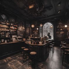 the interior of a restaurant with many tables and stools